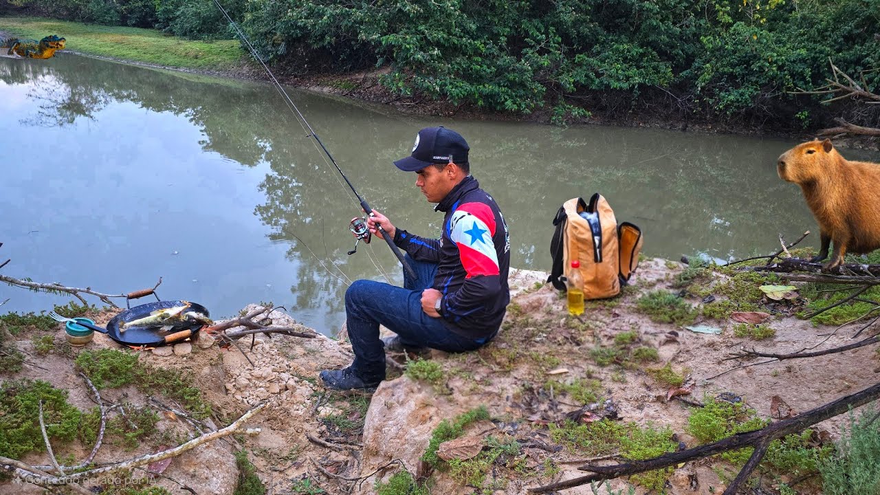 Fiquei perdido na pescaria, pescando e fritando peixe na beira do Rio.