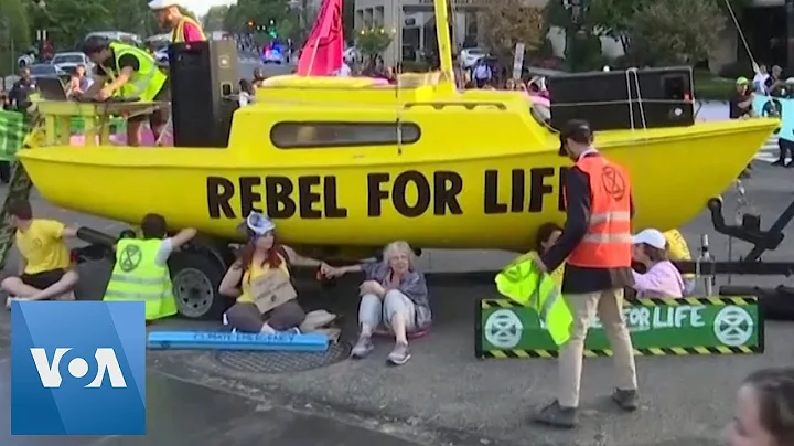 Climate Activists Block Traffic with Sailboat in Middle of Washington DC Intersection