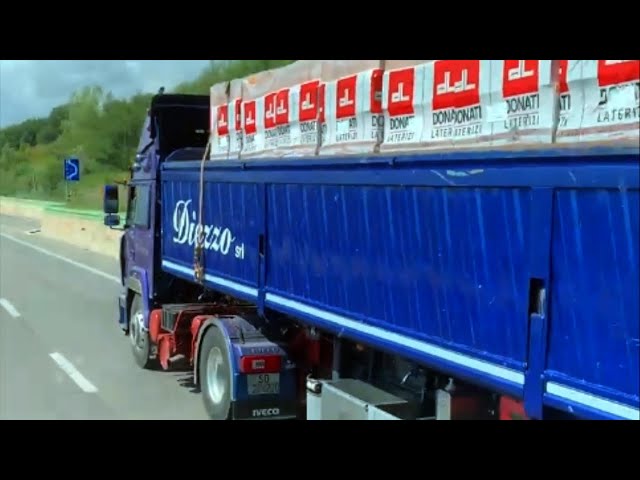 Scania s truck is overtaken uphill by an old Iveco v8 truck class=