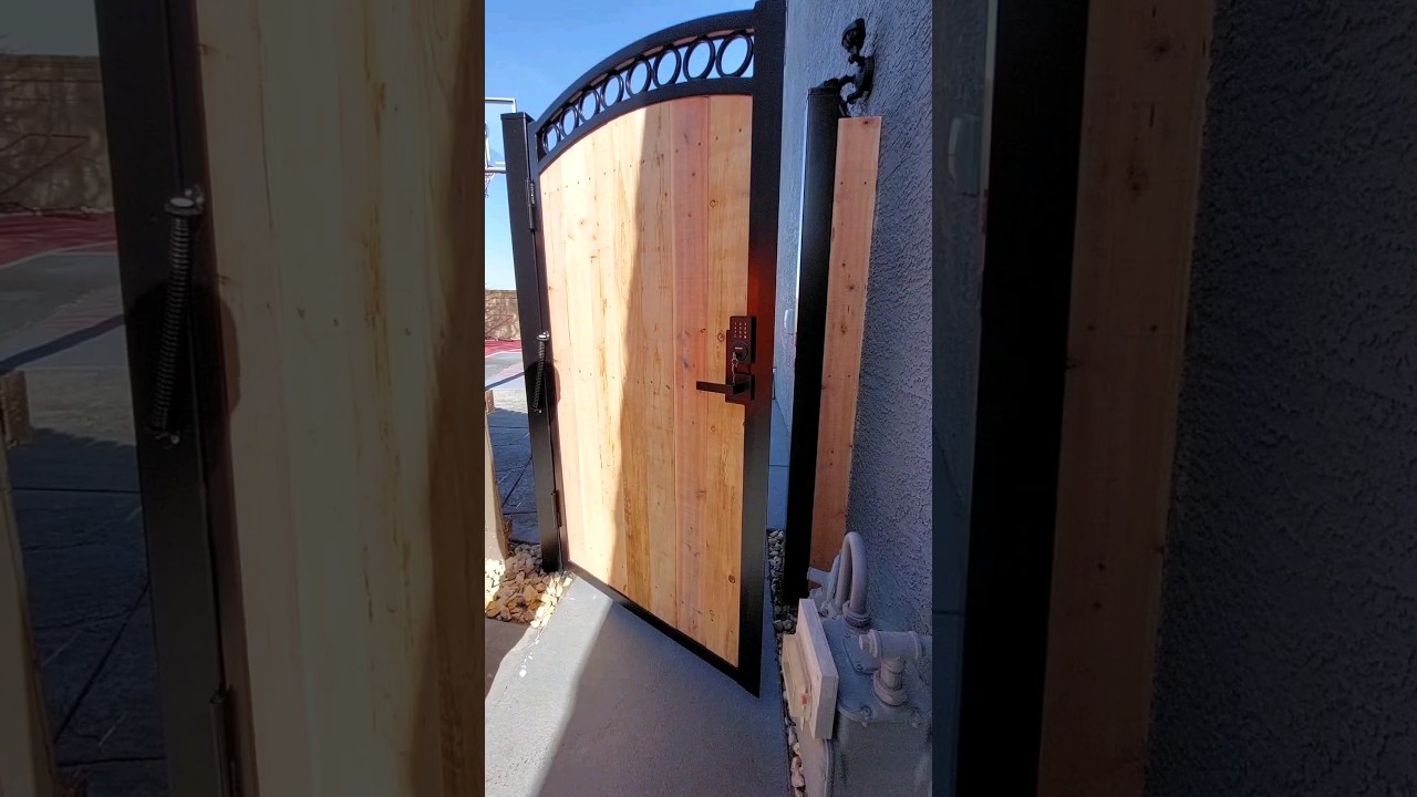 M&M Fencing Inc. arched and rings frame, self closing spring and keypad & handle combo