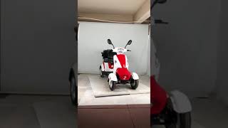 Factory direct four-wheel electric vehicle electric leisure scooter with net basket