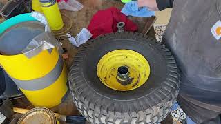 Replacing front wheel bushing with wheel bearings on John Deere D140 lawn mower !!!