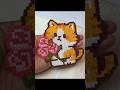 Use a rough-textured bath towel to heat up a cat holding a bouquet of flowers;
