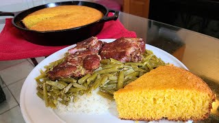 French Style Green beans and neck bones over rice with castiron skillet cornbread