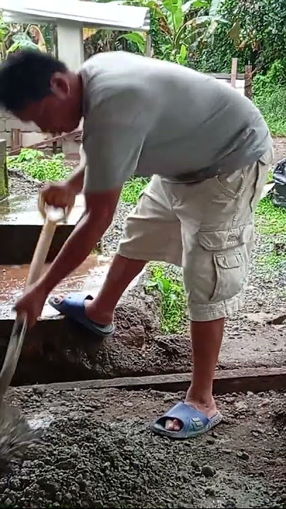 Mixing cement with aggregate for concrete post. | #shortvideo | #shorts