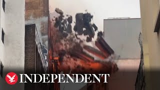 Wall collapses as massive fire engulfs seven storey building in Sydney