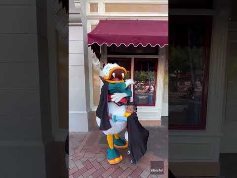 Young fan shakes a tail feather with his favorite, famous Disney duck #Shorts
