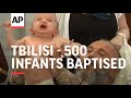 500 infants baptised in mass Orthodox ceremony