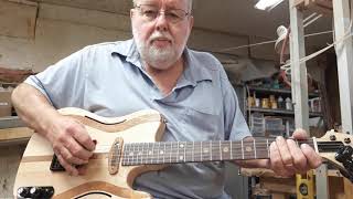 Through the body neck semi hollow body guitar