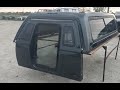 Walk around used fiberglass ARE MX series camper shell with walk-in door for sale. 99-16 Super Duty