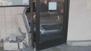 Stolen car crashes into Auburn CVS, suspect flees