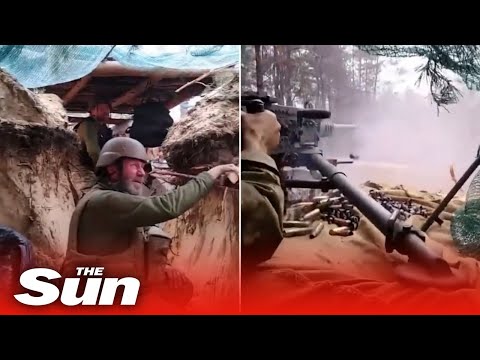 Ukrainian machine gunner fires at Russian forces from dugout.