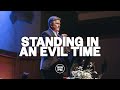 Standing in an evil time  carter conlon