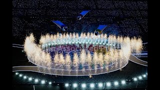 AP journalists join thousands at the San Siro Stadium to watch the Winter Olympics opening ceremony