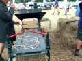 Stationary hay bailer.