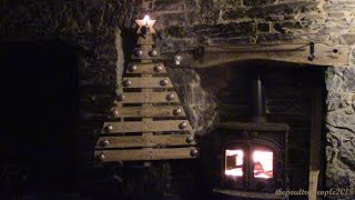 DIY Christmas Tree from wood pallets and a tree stump. Decorated with homemade ingots from the foundry and a rather fetching 