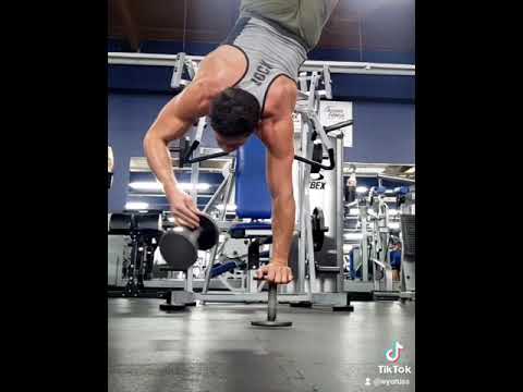 One handed handstand while spinning a dumbell. - One handed handstand while spinning a dumbell.