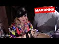 Madonna talking with fans while signing