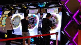 Young people having fun at games arcade