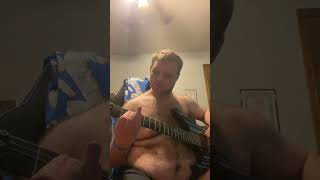 Me playing Mary on a cross on my guitar