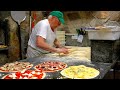 For 60 years roman pizza master baking more than 300 woodfired oven pizzas every day