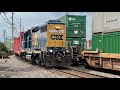 Csx train with caboose seems to be racing norfolk southern intermodal train  trains with dpus