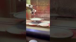 Painting barrel lids with robot