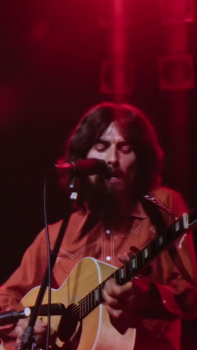 George plays 'Here Comes The Sun' to a sold out audience at The Concert For Bangladesh