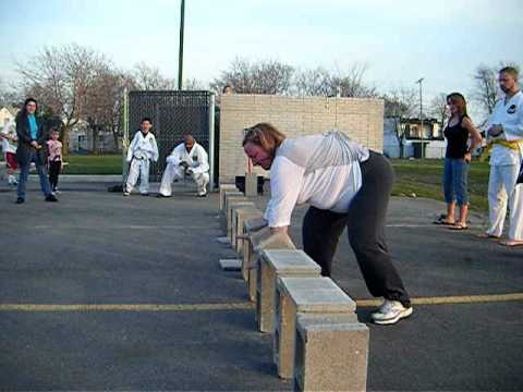 Wendy Defilippi breaks 10 bricks in seconds.