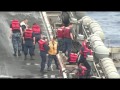 Aircraft Carrier On The Busiest Day Refuelling While Airplane Landing And Taking Off Is Continued