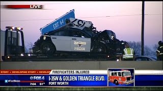 Firefighters hurt while investigating crash