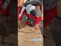 The chainsaw’s bar oil is flowing steadily like a small stream.
