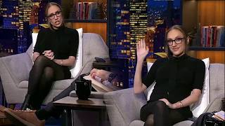 Details Kat Timpf seated in a short black dress with black, mostly opaque pantyhose.  Gutfeld! - 10/22/26 Guide