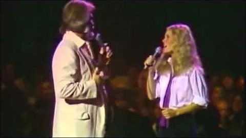 "Dont fall in love with a dreamer"-  Kenny Rogers & Kim Carnes.