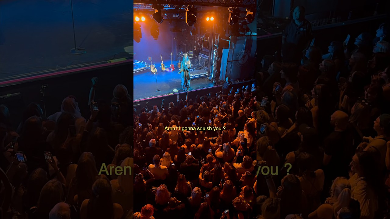 Crowd asking her to jump into the audience .