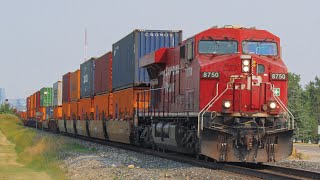 CP stack train with rumbling KCS units at rear at Ogden on the Brooks Subdivision.