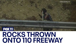 Cars damaged, motorcyclist crashes after man throws rocks onto 110 Freeway