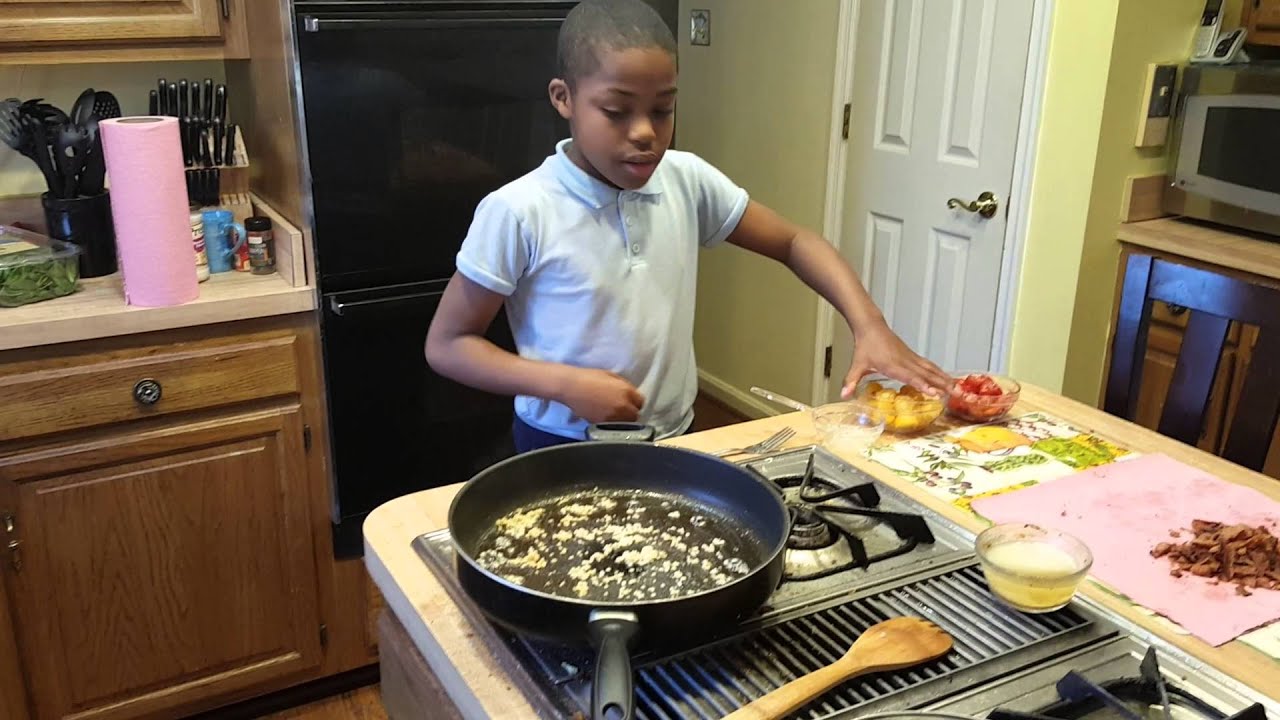 My grandson cooking Tuscan chicken pasta - YouTube