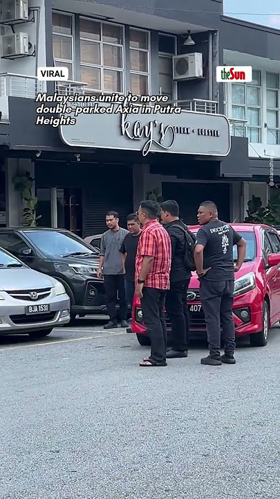 Malaysians unite to move double-parked Axia in Putra Heights