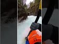 A Kayaker Paddles Through a Raging Rocky Gorge.
