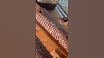 Checkering 1911 grips by hand. Check out www.gregsgrips.com