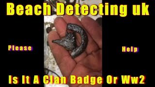 Beach metal detecting uk at a wwII d-day landing camp beach military badge relics & mystery finds