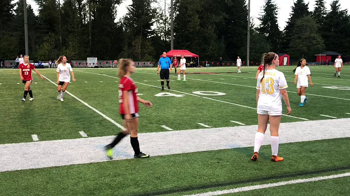Michaela Curran #5 in white with black leg wrap HS...