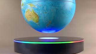 Large floating globe with multi color interactive base