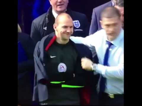 Slaven Bilic gives his jacket to the refree