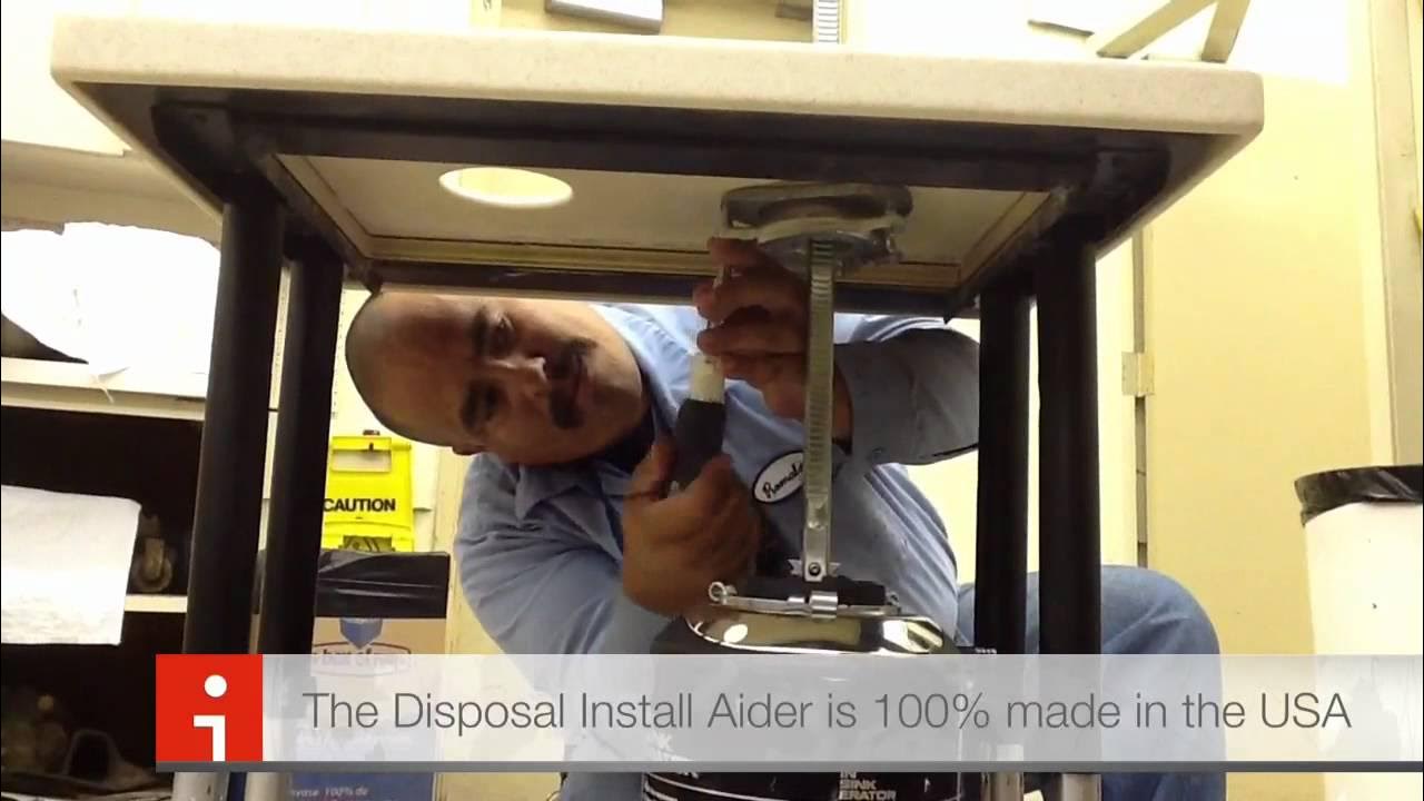 Garbage disposal installation tool. Installs snap ring and lifts