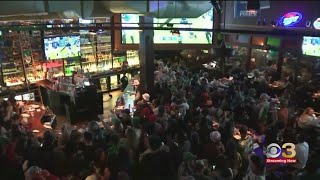 Eagles fans celebrate after their Birds defeat the Dallas Cowboys