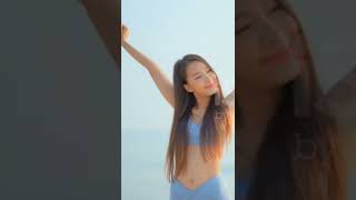 Young asian woman happy smile relax looking around sea beach ocean stock video...