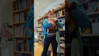 Using a baby sling. Baby wearing.