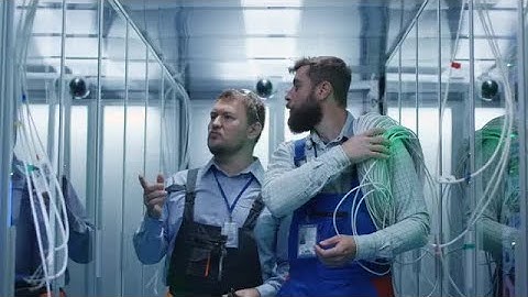 Technicians Walking In Server Room Stock Video